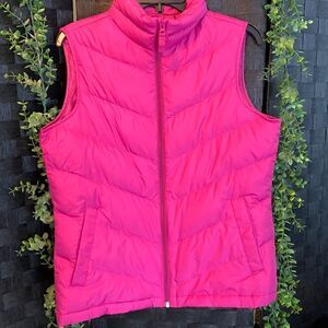 Lions and size small sleeveless pocketed vest.  NWOT & 80% down in 20% feathers